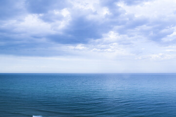 Obraz premium Calm windless ocean in blue tones.