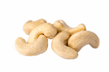 Raw cashew nuts on a white background.