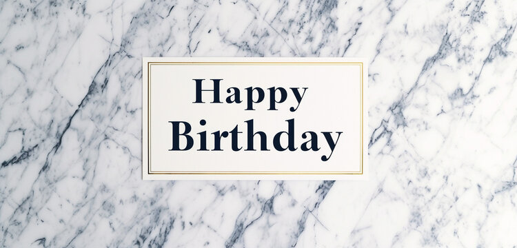 A photo text of "Happy Birthday" in elegant serif font on a classic marble background