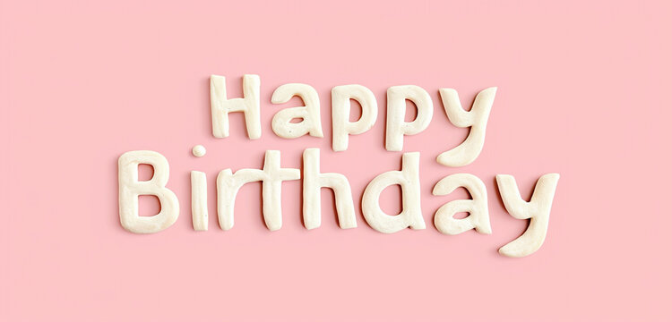 A photo text of the word "Happy Birthday" on a solid pastel pink background