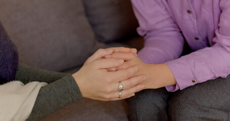 Close-up hands of a person experiencing difficulties touching the hands of a supportive individual, symbolizing empathy, compassion, understanding, and emotional support.
