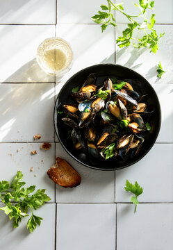 Mussels cooked and served with dry white wine and baquet