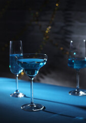 Glasses with blue alcohol cocktail ready for a party	