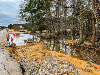 Insufficient water outflows cause flooding of areas near the road under construction