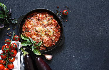 Casserole with eggplant, tomato sauce and cheese, top view, with space for text. Moussaka.