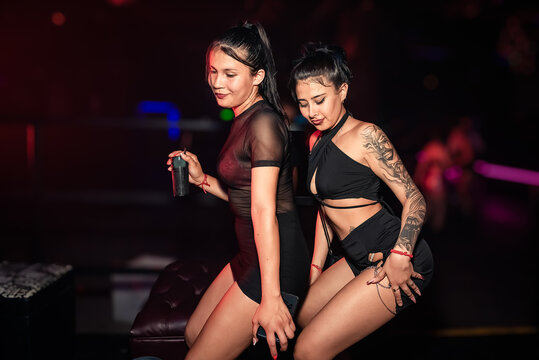 girls dancing to reggaeton rhythm at a party. perreo. twerking