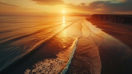 A breathtaking drone shot of a coastline at sunset