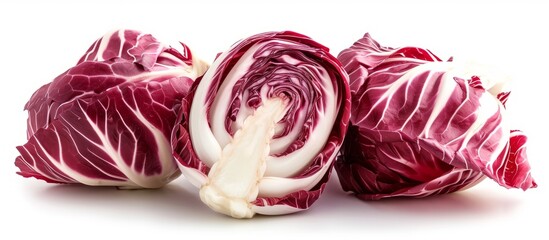 Obraz premium Fresh organic red cabbage cut in half on white background for healthy cooking and vegan recipes