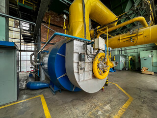 A gas burner added to an old coal boiler for burning waste gas from metallurgical technology
