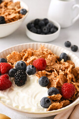 Breakfast with yogurt cereals and berries. - 752521883