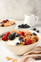 Breakfast with yogurt cereals and berries. - 752521894