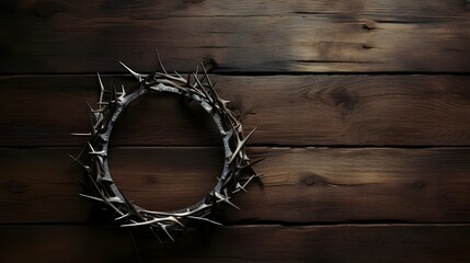 Above view reveals a crown of thorns resting on a rustic wooden table, symbolizing pain and sacrifice with stark simplicity