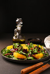Arugula, orange and pecan salad. Radicchio salad on brown background - 752525840