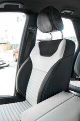 Close-up photo of the interior of a new car, leather seats