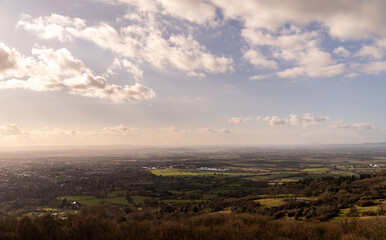 A sunset aerial view of Cheltenham and the Gloucestershire countryside, with distant fields, racecourse and farms