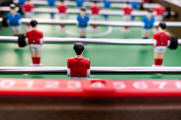 Close-up of figures of plastic players in a football match.