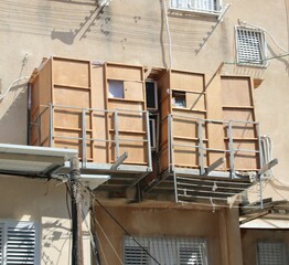 Sukkah for Sukkot from wooden sides and sheets on the street