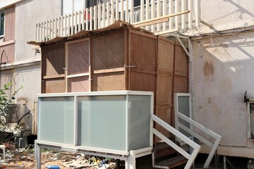 Sukkah for Sukkot from wooden sides and sheets on the street
