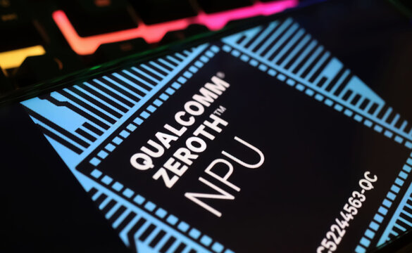 Viersen, Germany - March 1. 2024: Closeup of smartphone screen with logo lettering of Qualcomm Zeroth NPU neural processor on computer keyboard
