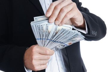 Business man holding money on white background