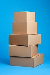 Neat Pile of Boxes on a Blue Backdrop. Moving concept