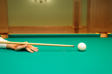 Billiard player aiming at billard table or snooker american billiards pool sport game - 752557601