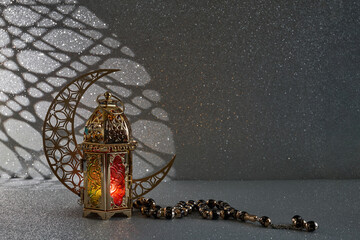 Ramadan Kareem. golden moon and lantern on glowing background for Holy month Ramadan celebration