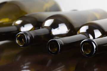 empty glass bottles. Wine bottle on white background close-up. Glass, vessel, neck, wallpaper,...