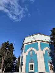 Bursa Green Tomb (Yesil Turbe). Green shrine behind trees at Bursa-Turkey.Tomb of Celebi Sultan Mehmet.