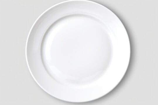 White plate with silver fork and knife on top. Perfect for restaurant menus or food blogs
