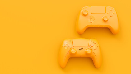 Video game joysticks or gamepads in plain monochrome yellow color background © Vasyl Onyskiv