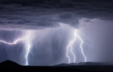 Naklejka na ściany i meble Thunderstorm lightning strikes. Stormy weather at night