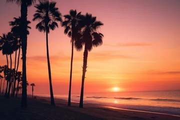 Fototapeten Beautiful sunset scene with palm trees on the beach, perfect for travel and vacation concepts © Fotograf