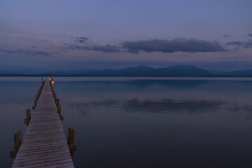 Wooden pier leaks into the lake chiemsee