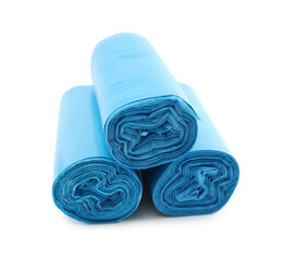 Rolls of light blue garbage bags isolated on white