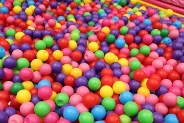 Fototapeta na wymiar Many colorful balls as background. Kid's playroom