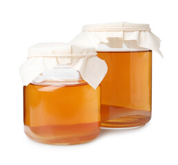 Tasty kombucha in glass jars isolated on white