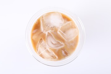 Plastic cup of fresh iced coffee isolated on white, top view