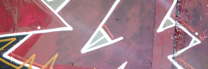 Colorful background of graffiti painting artwork with bright aerosol outlines on wall. Old school...