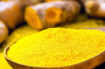 spoonful of turmeric powder, Indian culinary spice