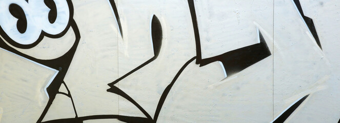 Colorful background of graffiti painting artwork with bright aerosol outlines on wall. Old school...