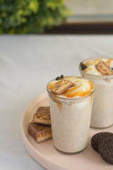 Milkshake with caramel and chocolate in transparent glasses
