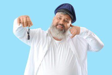 Mature taxi driver with car key showing 