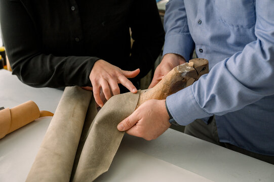 Traditional shoemaking process with leather and tools