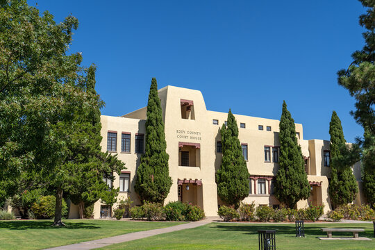 Carlsbad, NM - Oct. 10, 2023: The Eddy County Court House, originally built in 1891 in Victorian style of locally made dark red brick, was remodeled to its current Spanish architectural style in 1939.