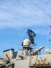 Radar system of a warship. Militarism. Ship electronics. tower against the sky
