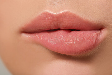 Fototapeta premium Lips of beautiful young woman, closeup