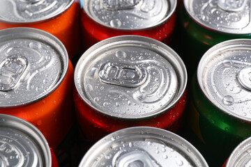 Energy drinks in wet cans, closeup. Functional beverage