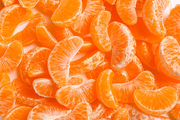 Texture of sweet peeled mandarins as background