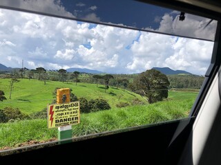 Showing danger board in farming landscape